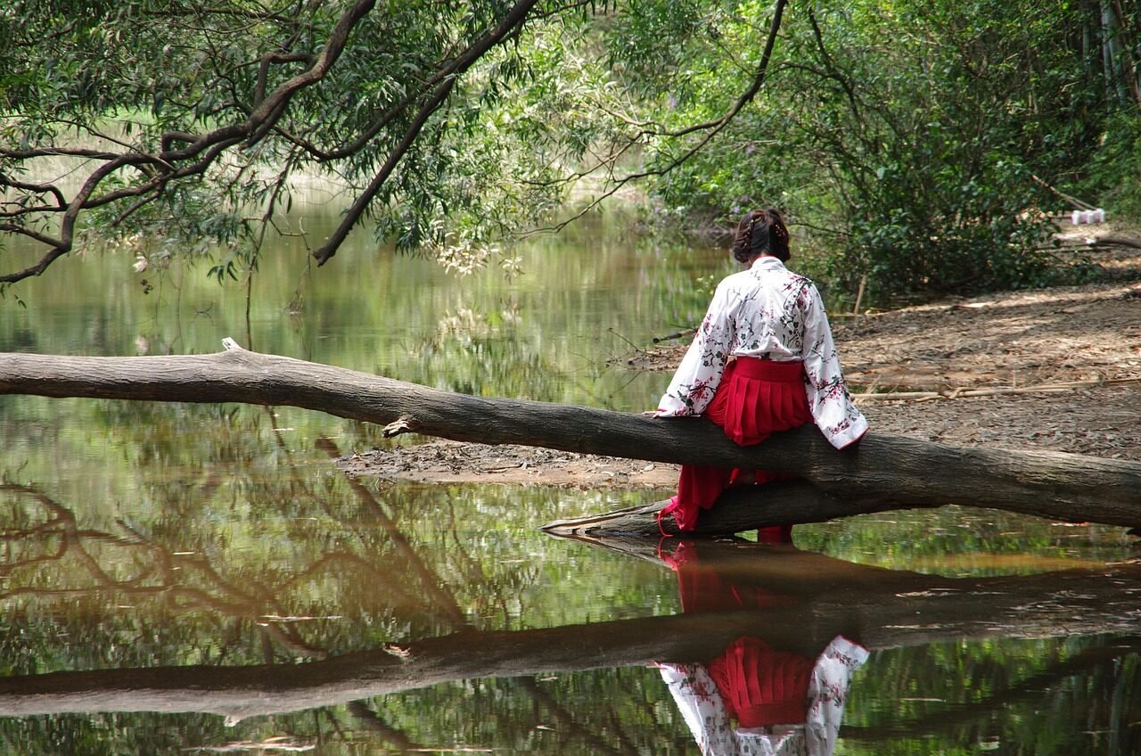back view, yiren, waterside, woman, female, red skirt, lake, pond, tradition, clothing, nature, asia, china, reflection, trunk