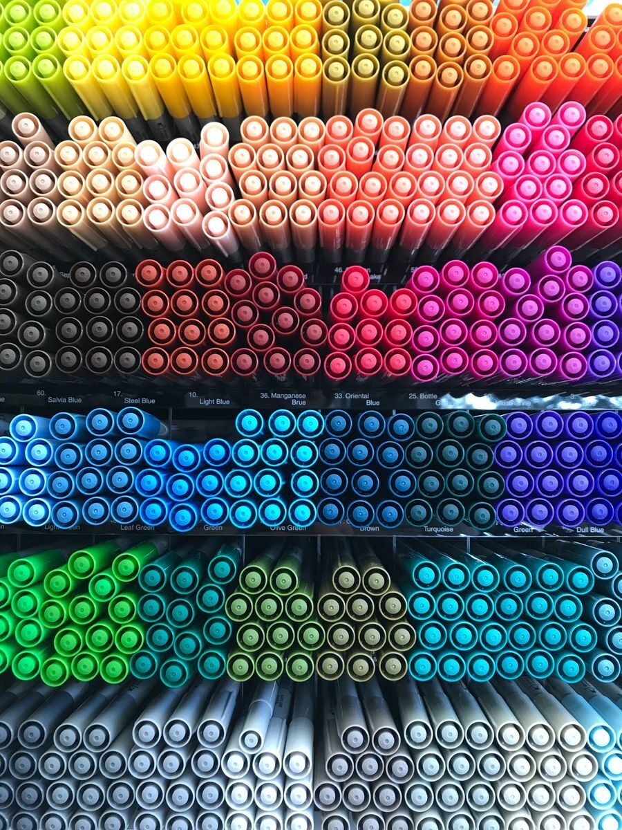 An organized arrangement of multicolored marker pens displayed in a vibrant array, highlighting color variety.