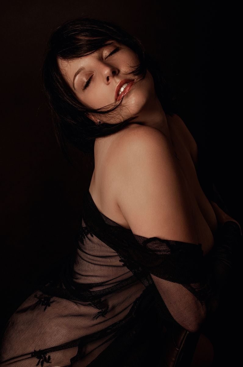 A captivating portrait of a woman in lace, exuding elegance and sensuality.