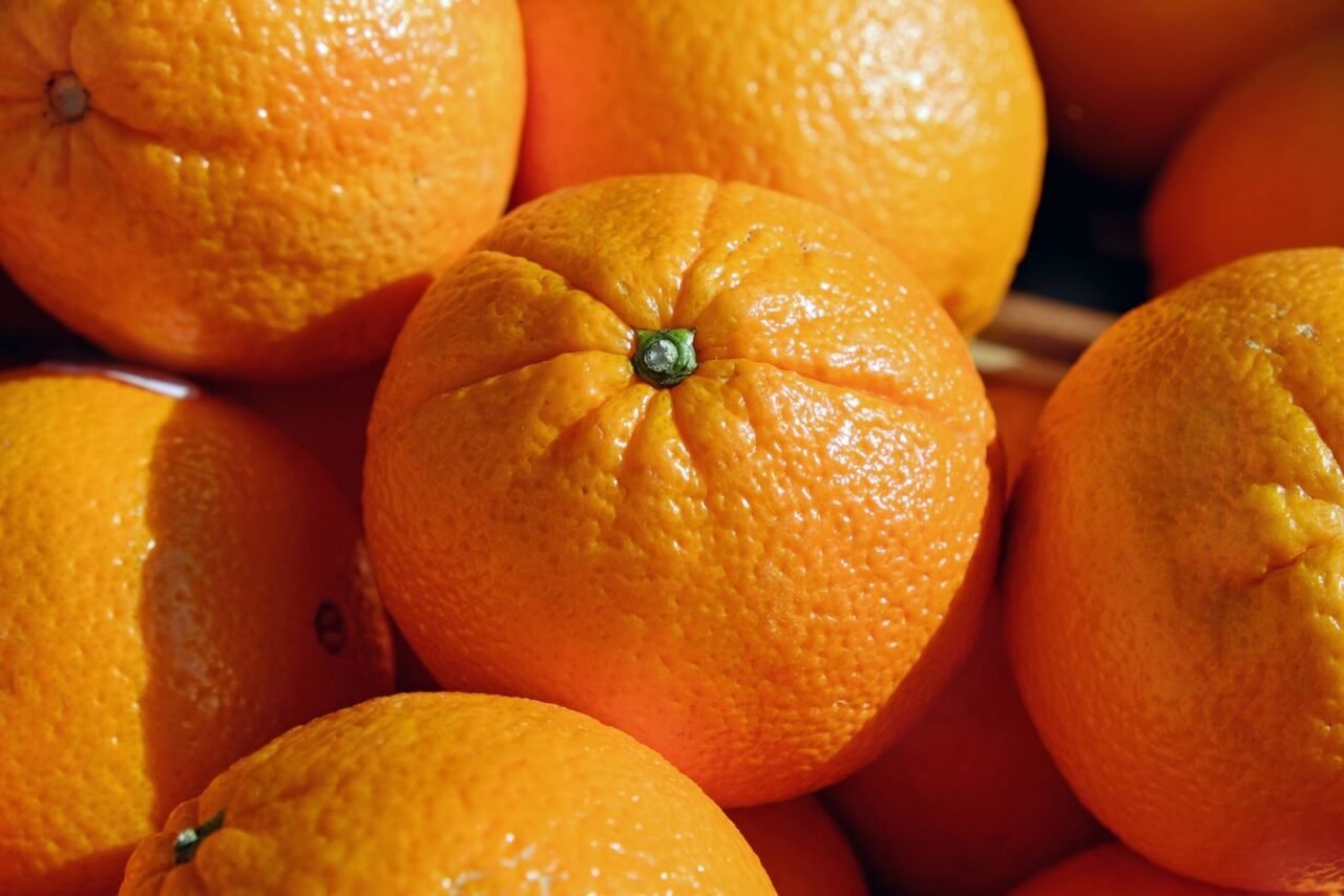 A close-up shot of fresh juicy oranges showcasing vibrant color and texture.