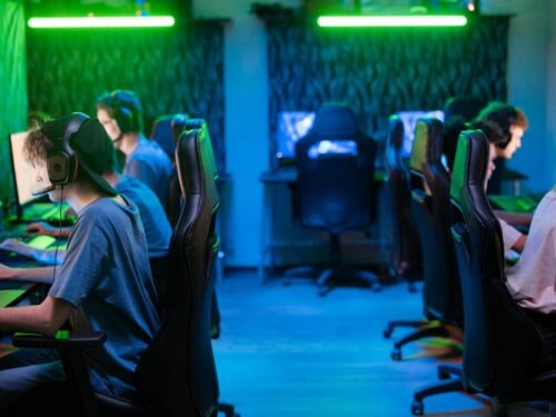 A vibrant gaming scene with a focused esports team immersed in intense gameplay.