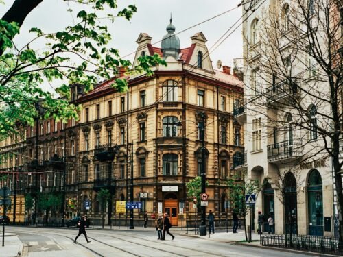 people walking near beige building