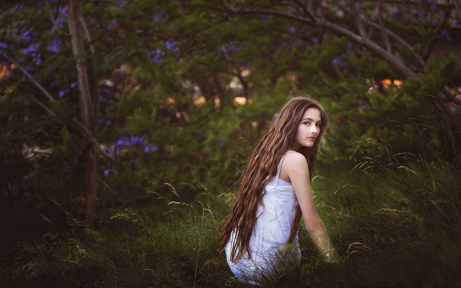 Girl in the grass long hair look nature.jpg