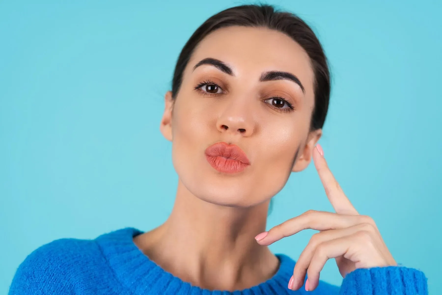 Beauty portrait young woman blue knitted sweater