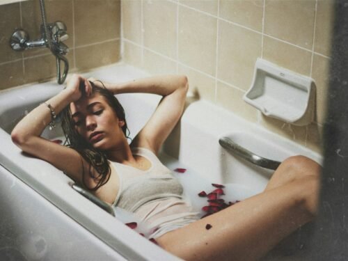 woman lying on bathtub