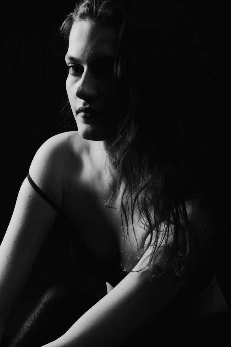a black and white photo of a woman with long hair