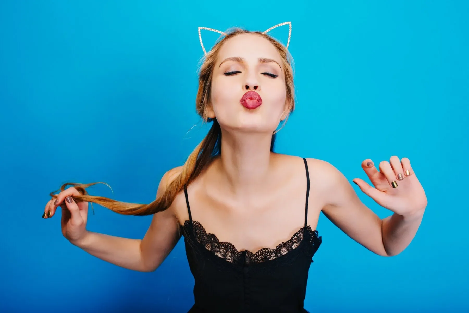 Closeup portrait cute girl giving kiss posing