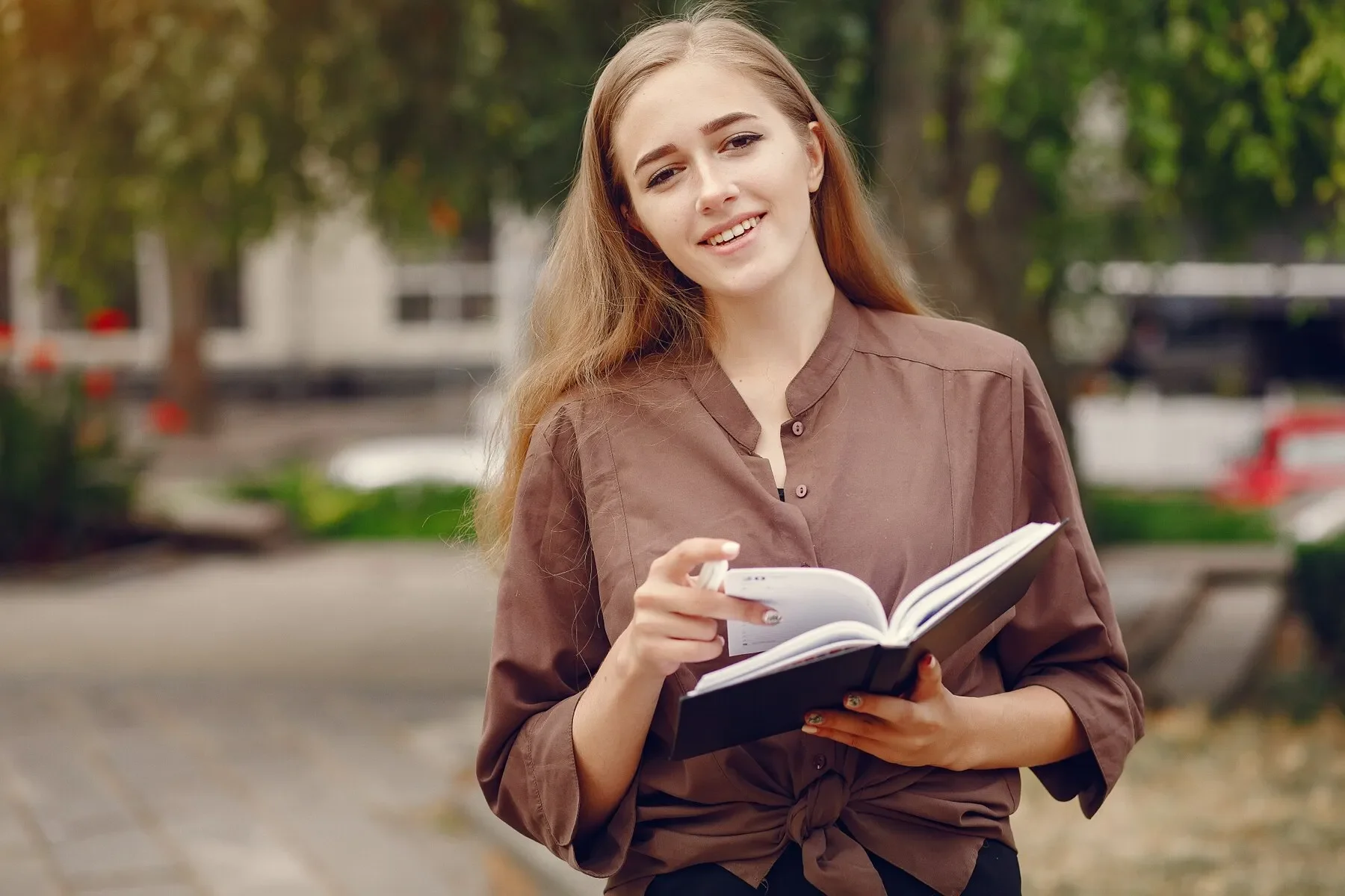 Cute student working park use notebook