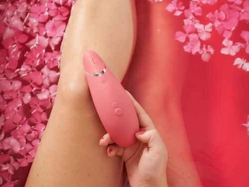 person with pink hearts on her lap