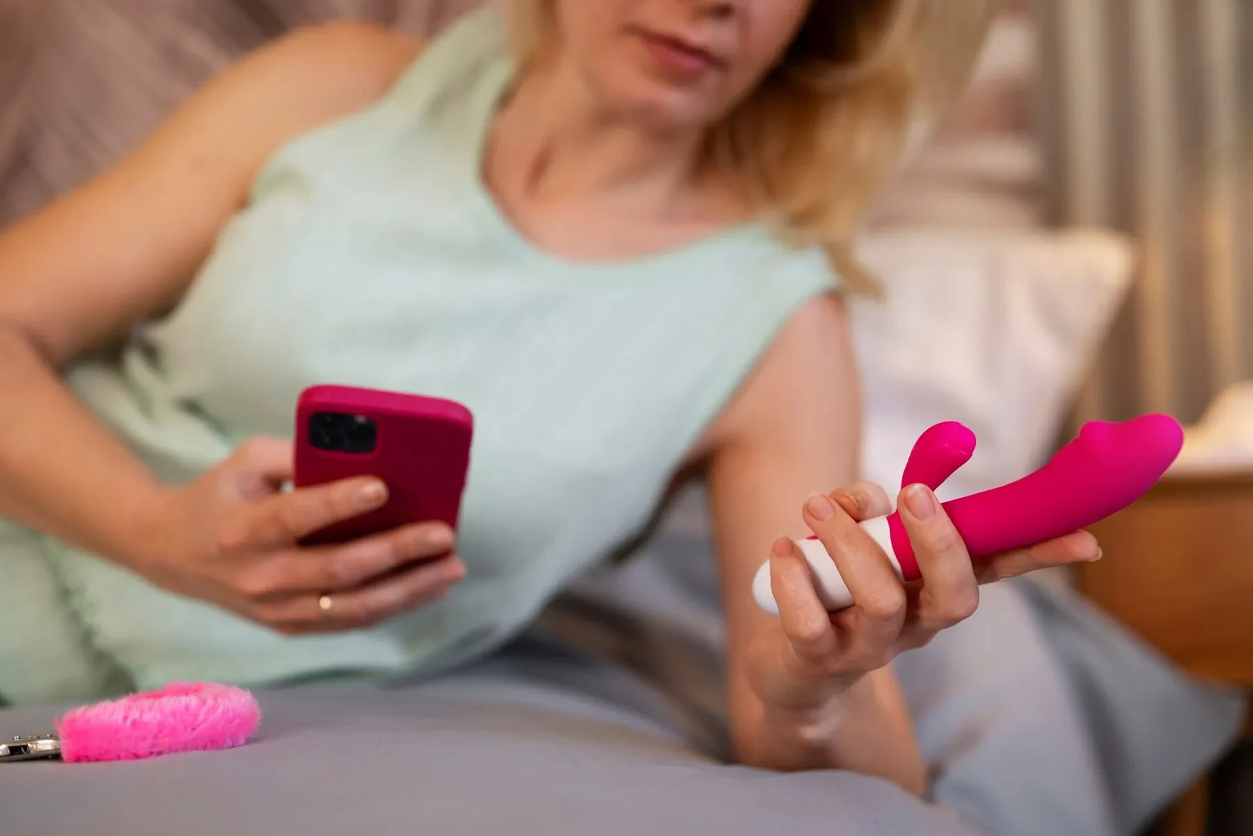 Front view woman with smartphone vibrator