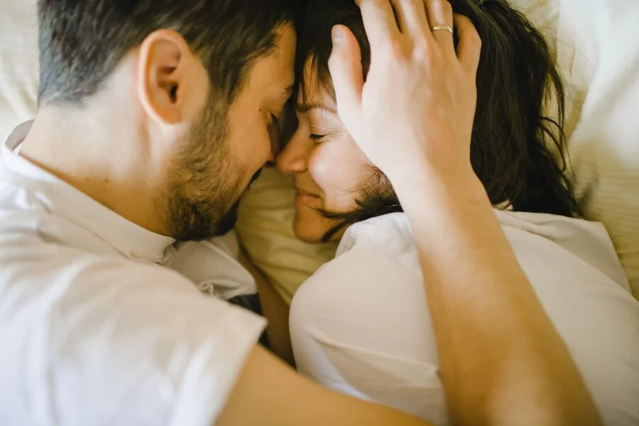 Glad husband wife hugging bed 8353
