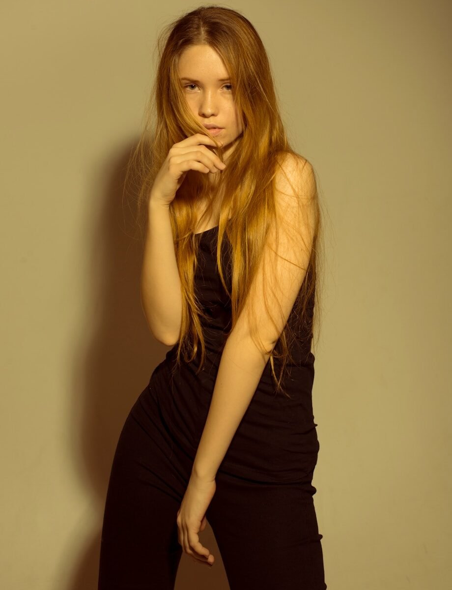 woman standing beside wall