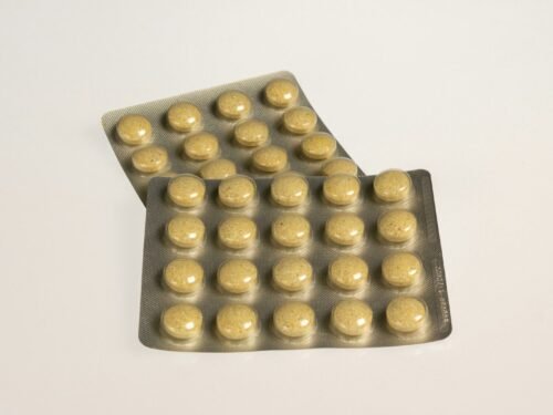 a close up of two contraptions on a white surface