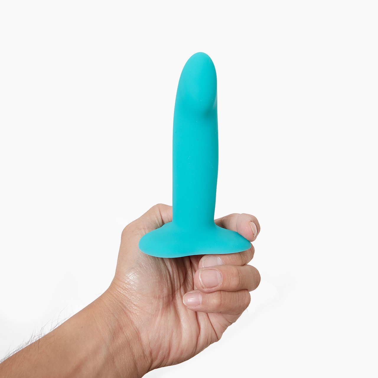 A hand displaying 'Fun Factory Limba Flex Small', a silicone dildo with a suction base A hand displaying 'Fun Factory Limba Flex Small', a silicone dildo with a suction base