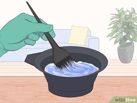 Step 3 Put on plastic gloves and mix the hair dye according to the directions.