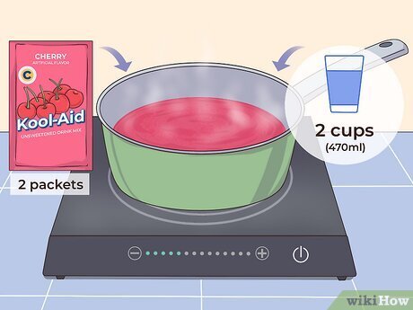 Step 1 Mix 2 packets of Kool-Aid with 2 cups (470 ml) of water in a saucepan.