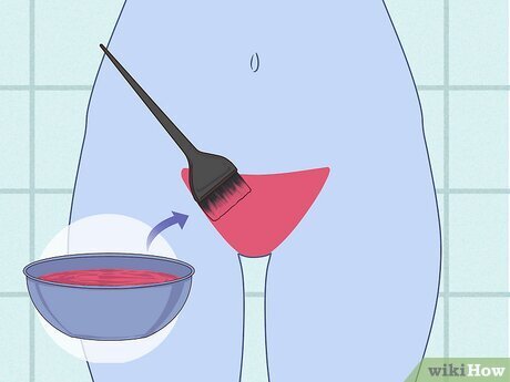 Step 4 Use a hair applicator brush to apply the mixture to your pubic hair.