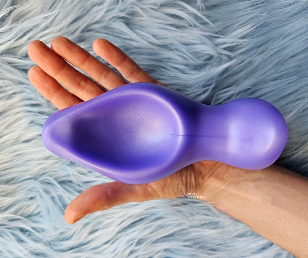 Large silicone vaginal plug shown for size reference