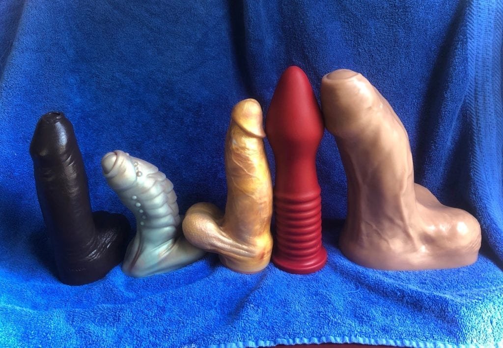 Large dildo size progression lineup showing increasing girth for comparison