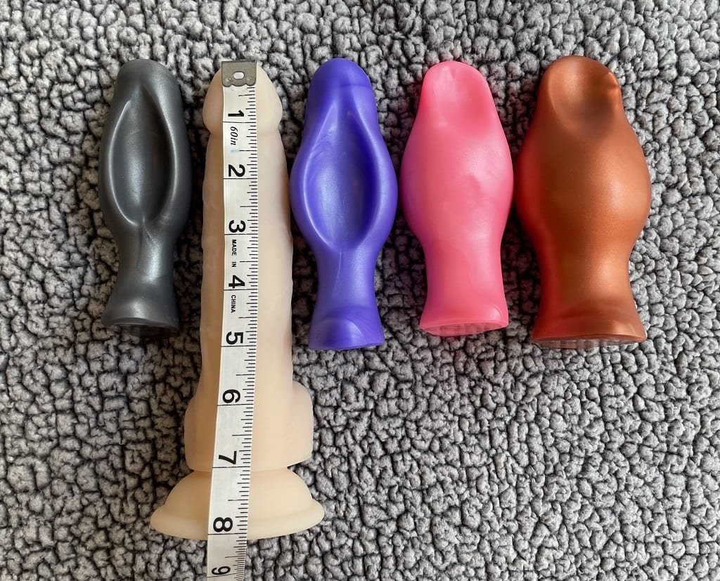 Measuring silicone toys plug with a soft tape measure to check length, then circumference