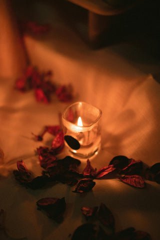 Candles and rose petals in a subdued atmosphere