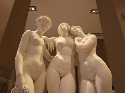 Three classical marble statues of women