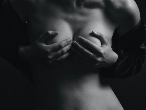 a black and white photo of a naked woman