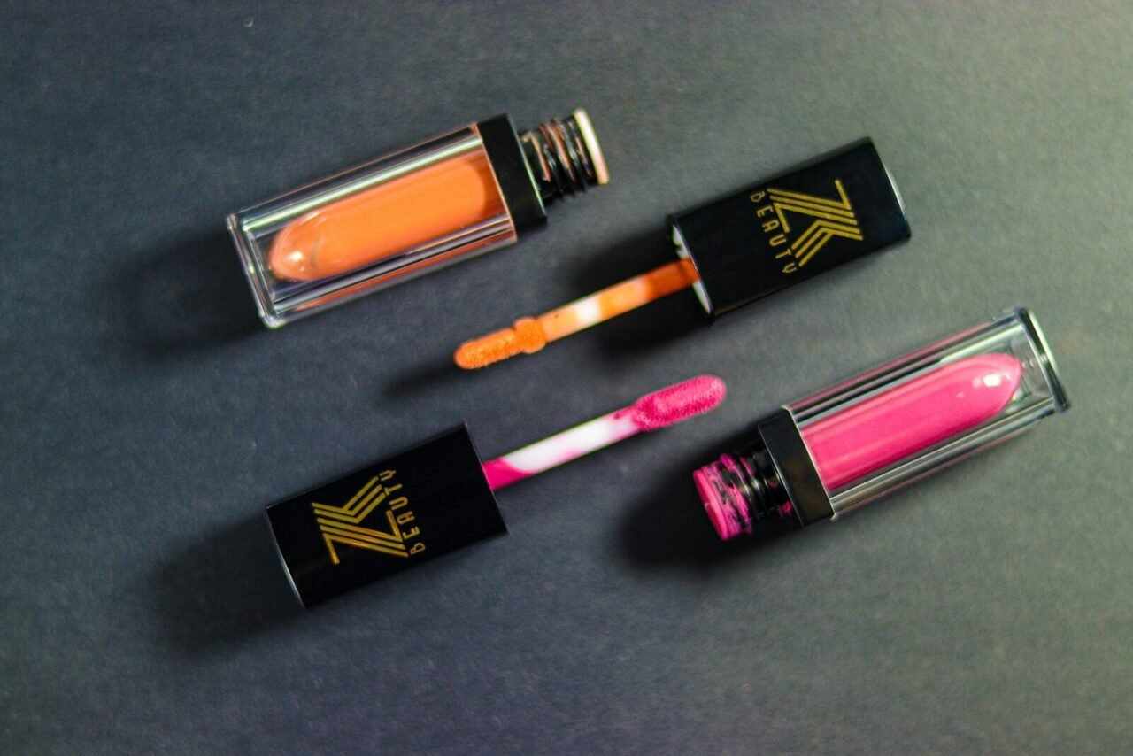 A group of three lipsticks sitting on top of a table