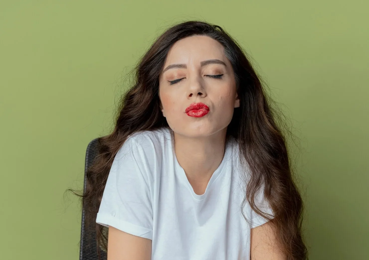 Peaceful young pretty girl sitting makeup table
