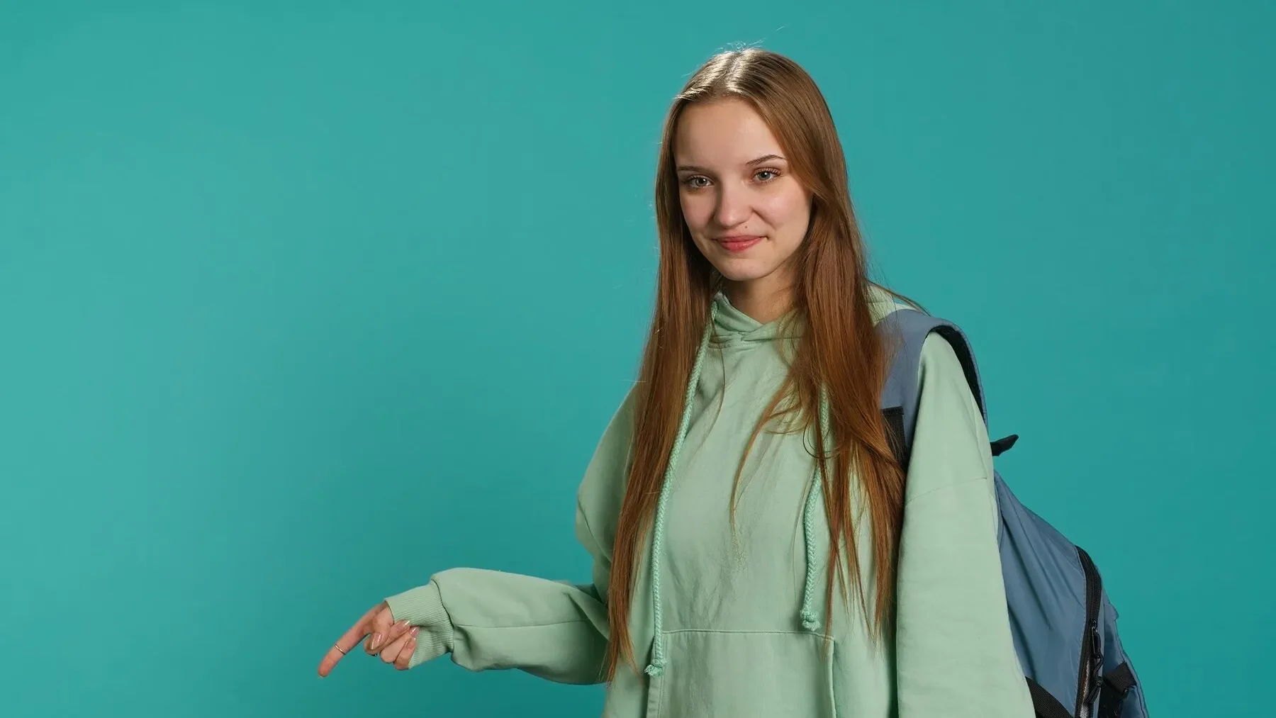 Portrait cheerful person pointing finger towards