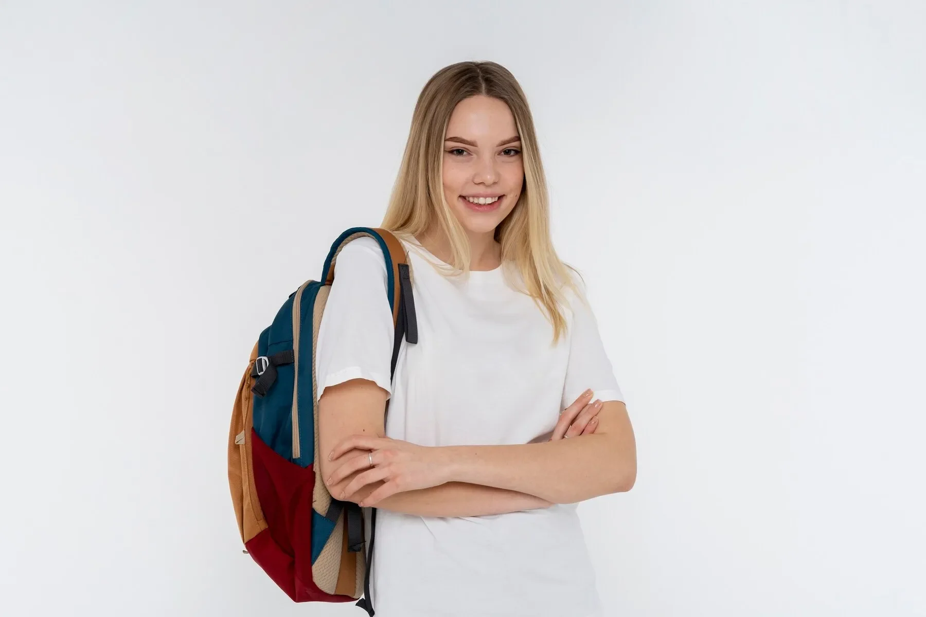 Portrait teen girl holding her backpack