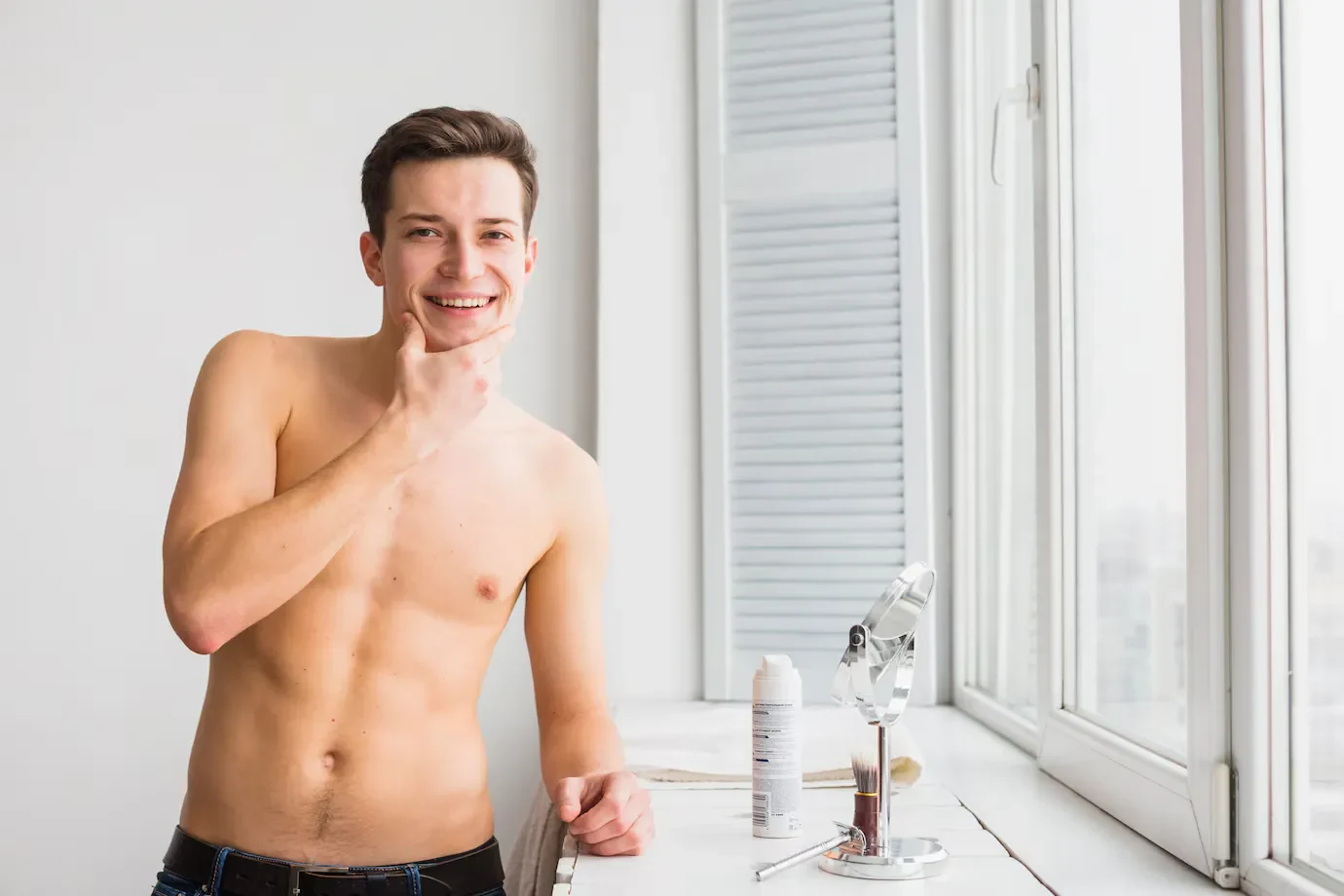 Shaving concept with attractive young man