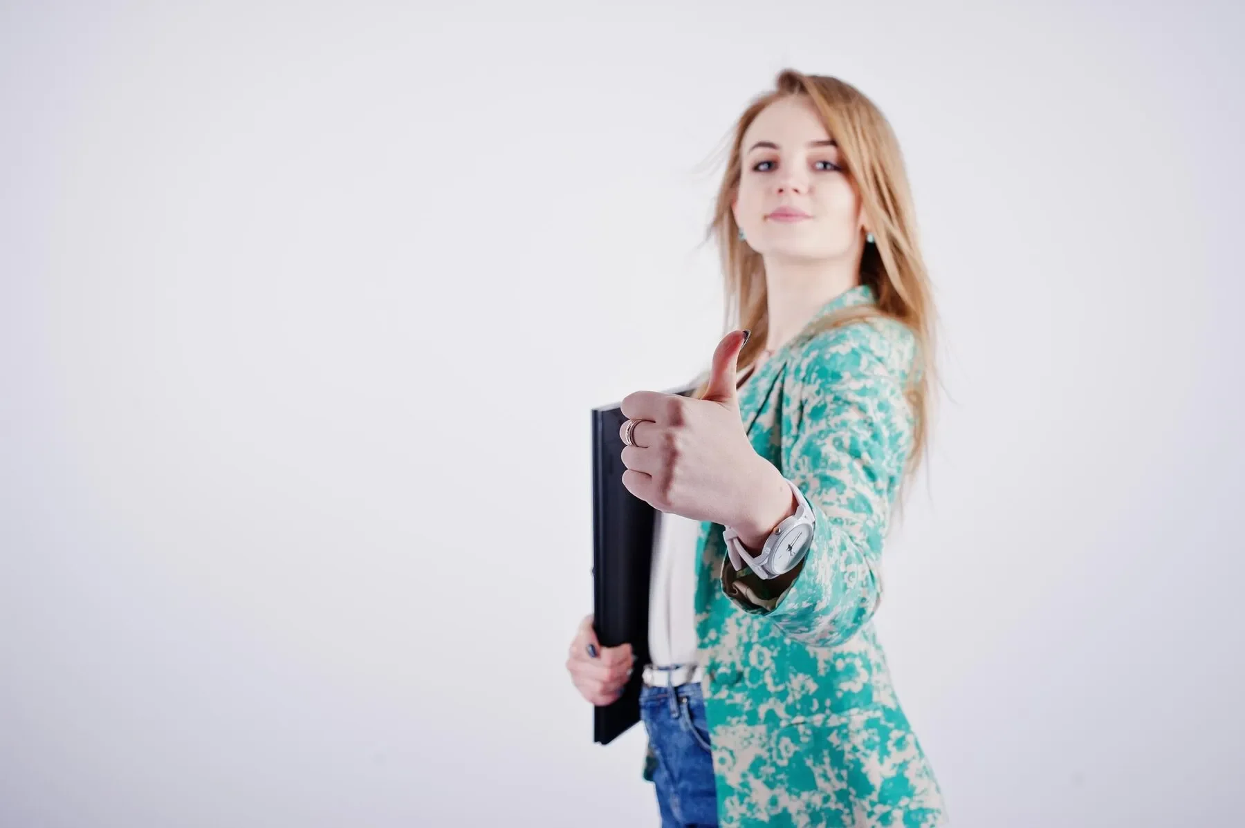 Stylish blonde girl jacket jeans with notebook diary
