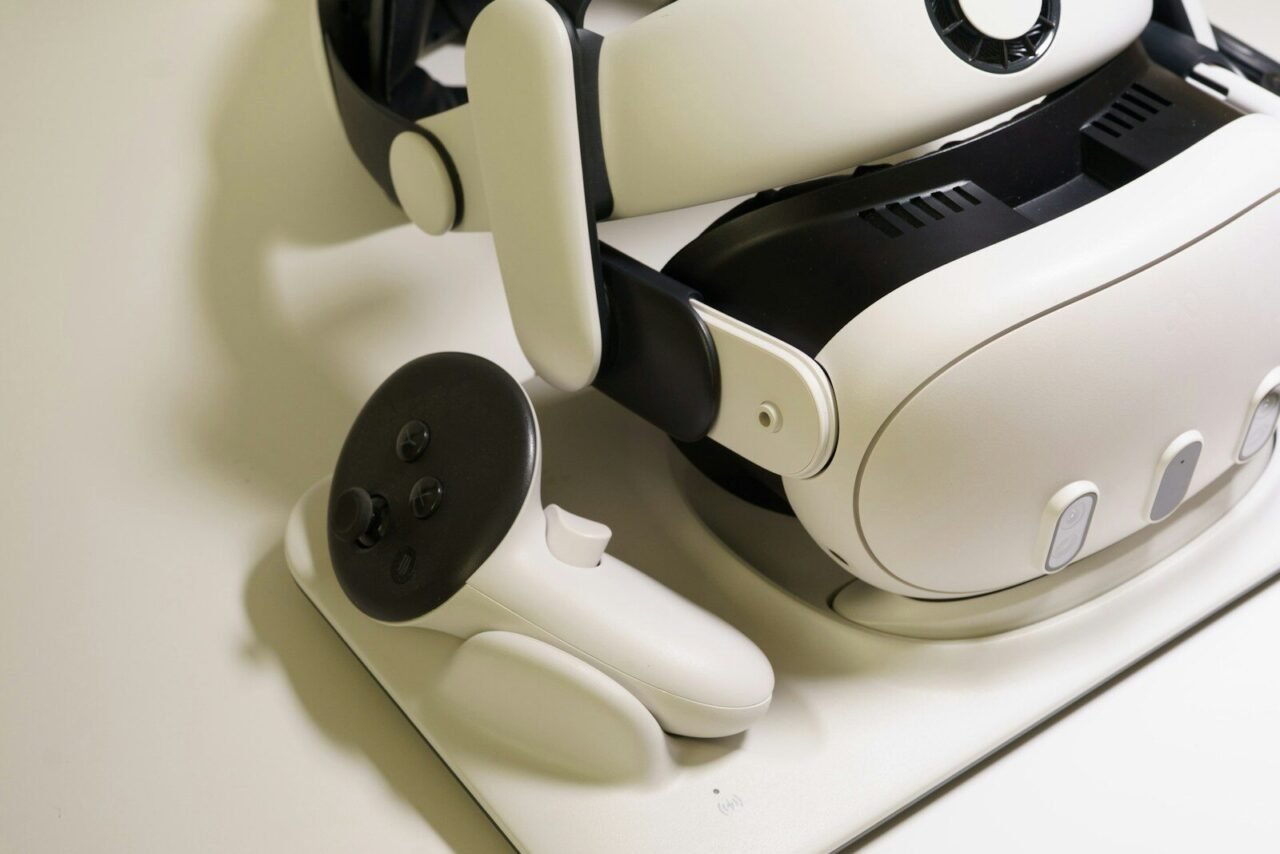 White virtual reality headset and controller on table