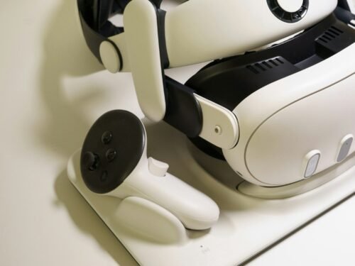 White virtual reality headset and controller on table