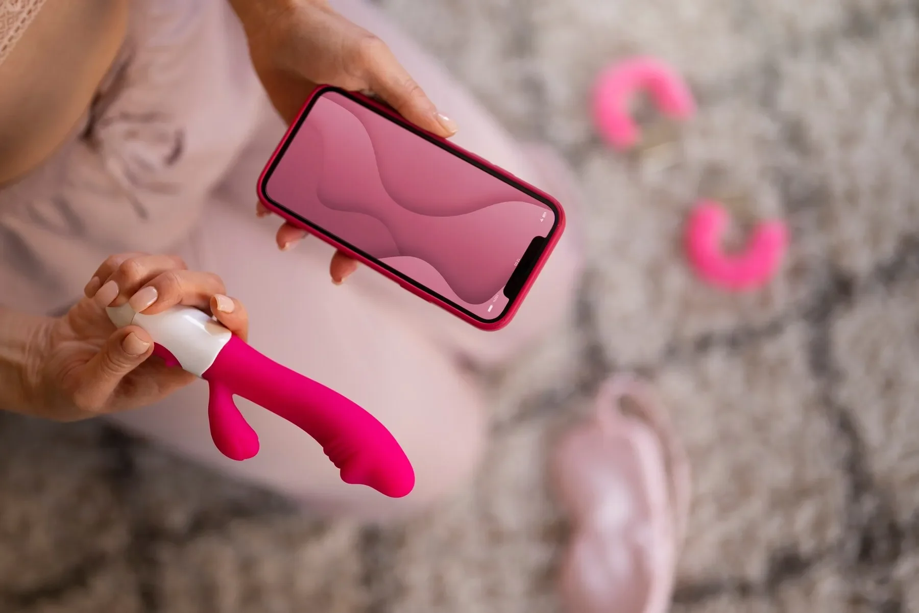 Top view woman with smartphone vibrator