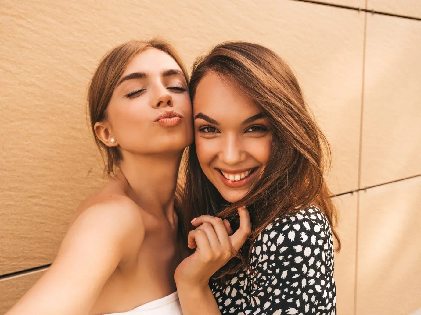 Two young smiling hipster women summer clothes