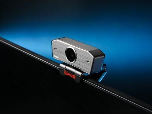 black and silver camera on black background