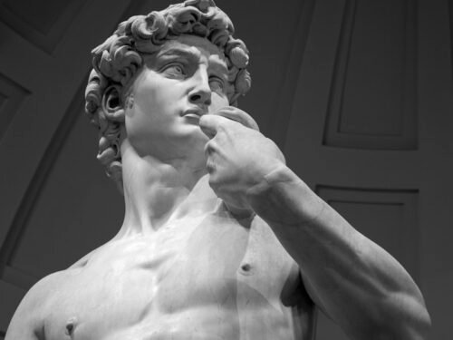 topless woman with white hair statue