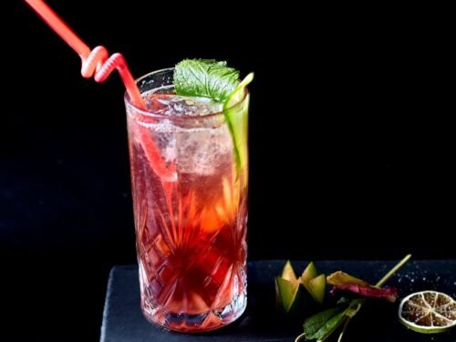 clear drinking glass with red liquid and ice