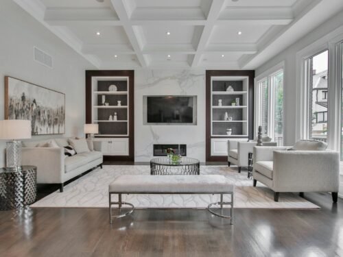 white wooden coffee table near white sofa