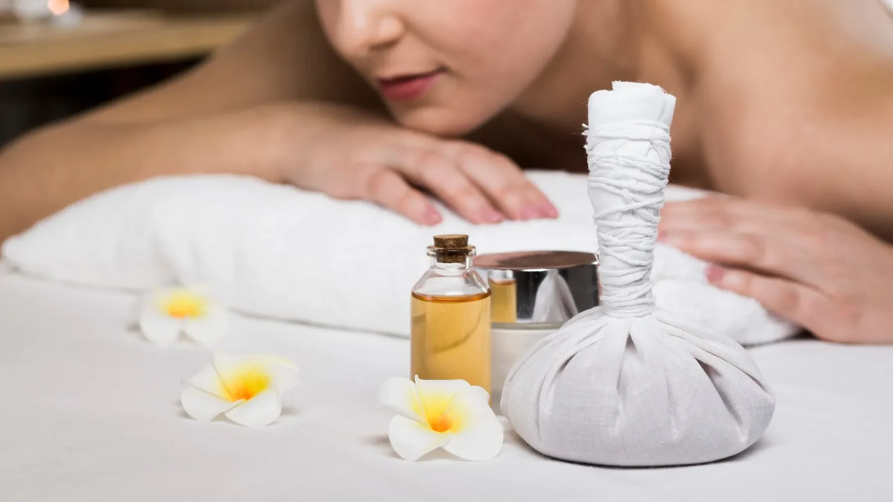 Woman receiving massage spa center