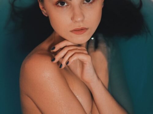 half naked woman on bathtub