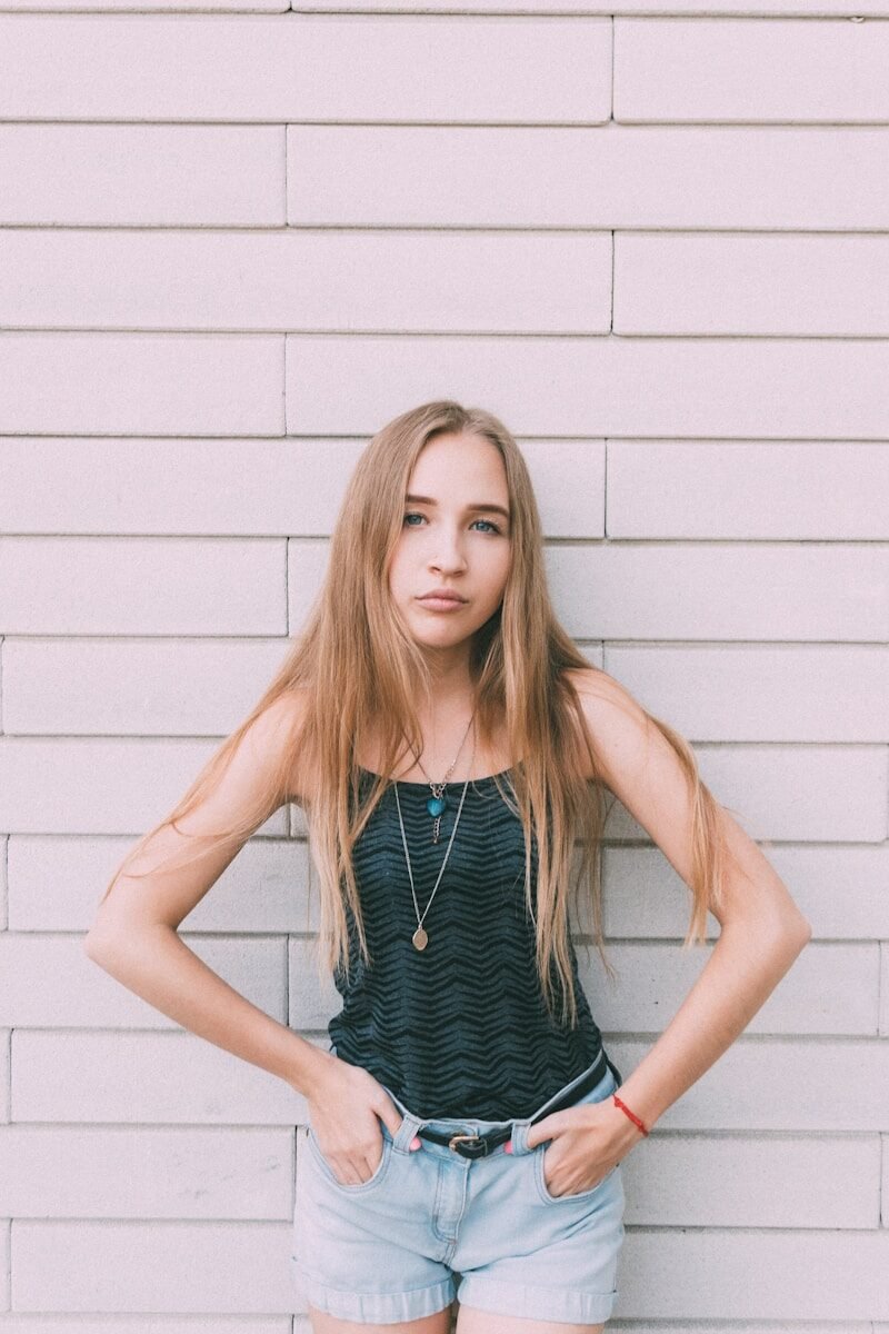 woman in black and white spaghetti strap top