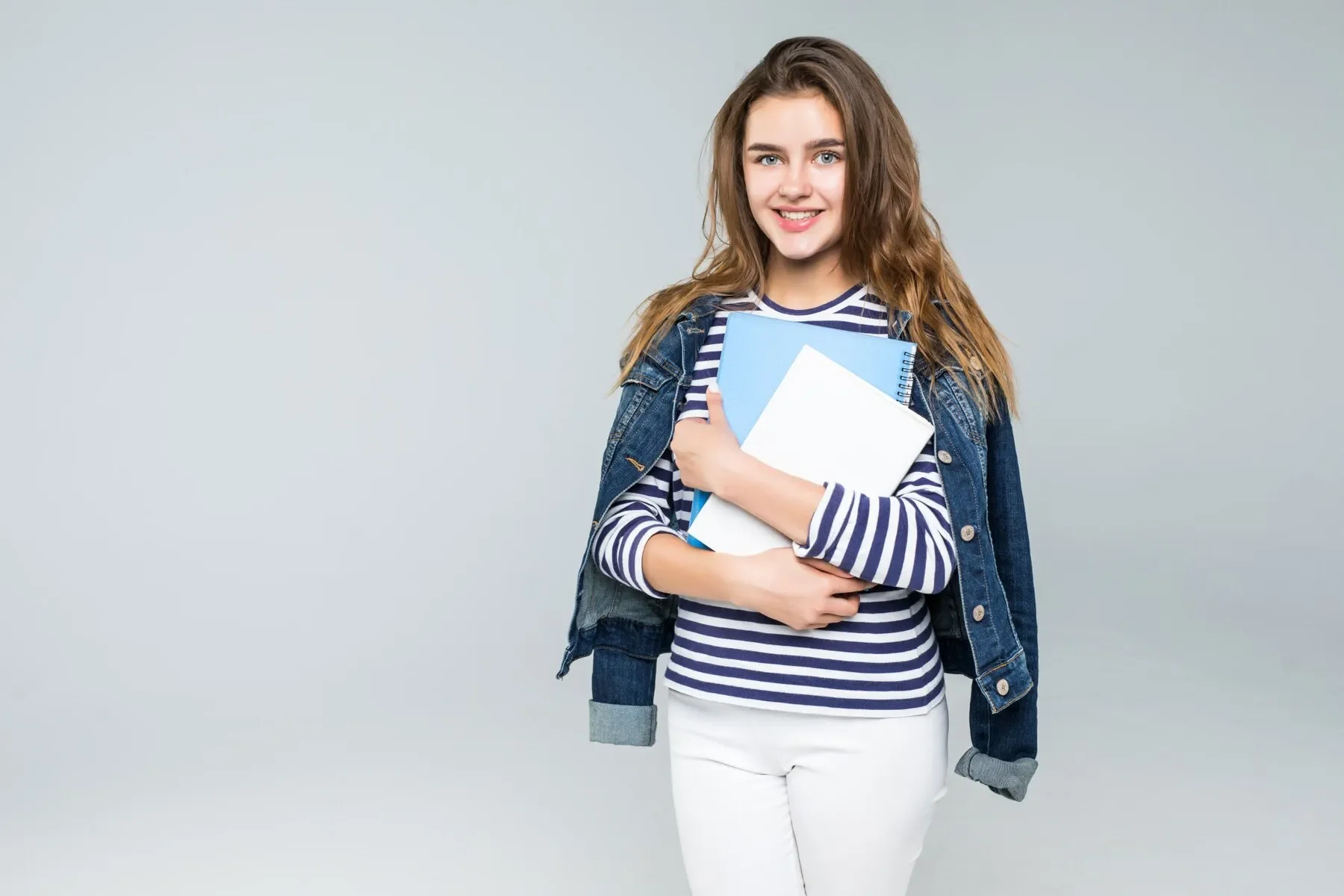 Young smiling student woman white background
