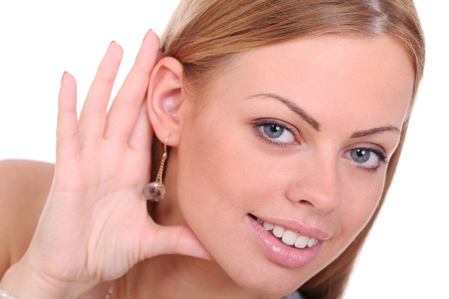 Young smiling woman tries listen