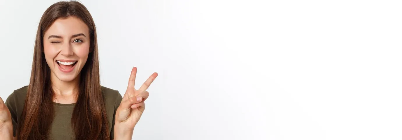 Young woman showing two fingers